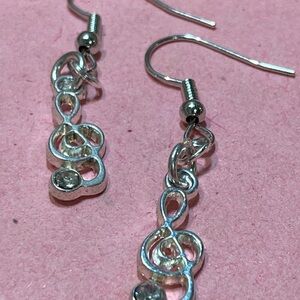 Silver toned music note earrings, French hook.